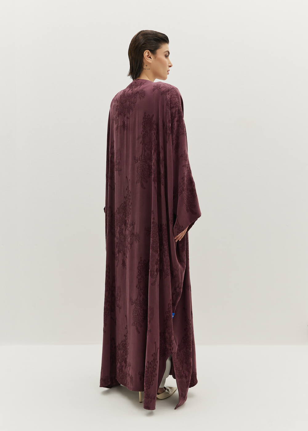 Velours Bloom abaya by Sadim Designs — mulberry silk chiffon with tonal floral detailing and fluid drape.